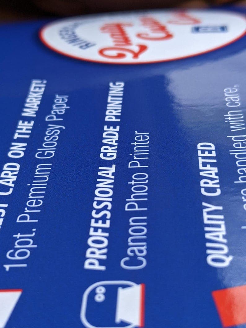 Close-up of premium glossy card stock and professional printing